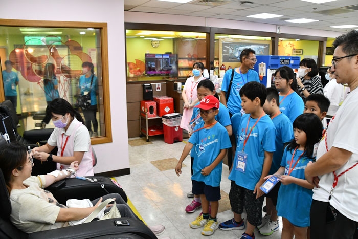 Children observing the blood donation process