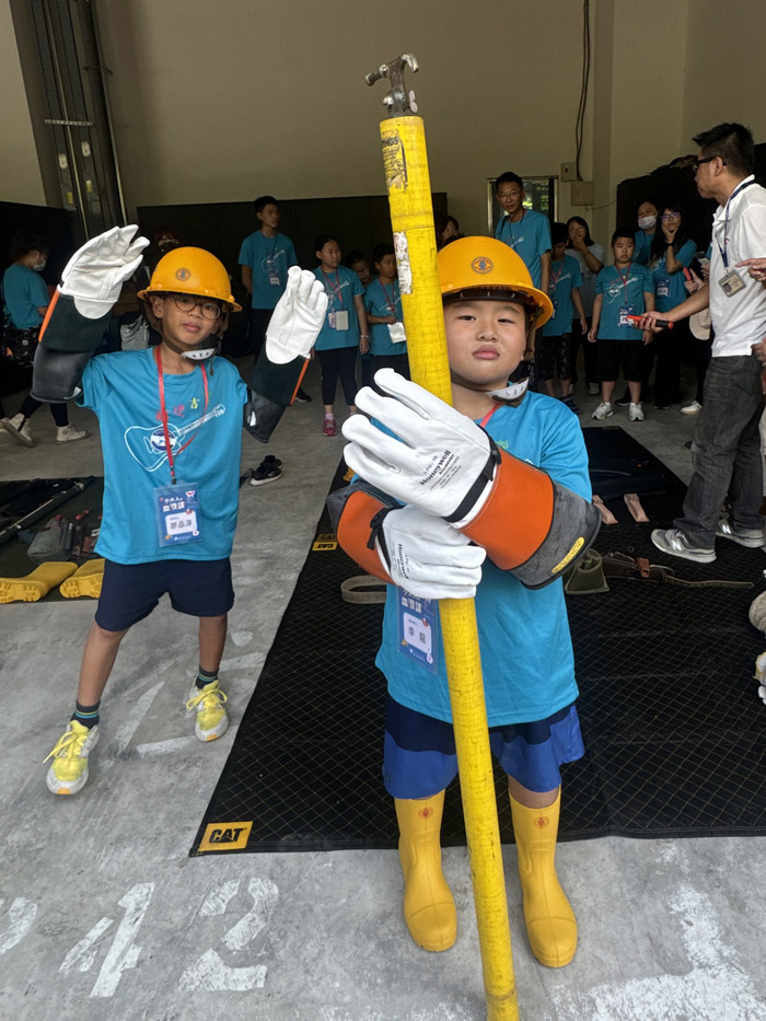 Children try on the gear to experience the hard work of the staff.